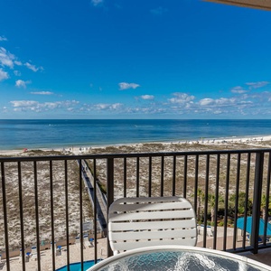 Savor your morning coffee on the balcony while enjoying expansive views of the tranquil waters and vibrant blue sky