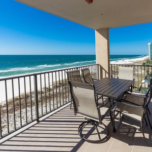 Enjoy meals or drinks on the spacious balcony while taking in the beautiful coastal views