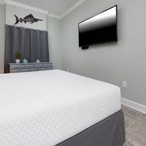 Stream your favorite show and relax in the king master suite after a day at the beach