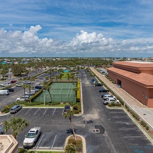 Take in the view of nearby tennis courts and lush greenery from your master balcony