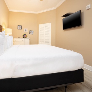 Relax on the cozy king bed in this guest suite and stream your favorite shows after a beach day