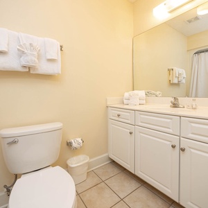 Refresh your senses in this guest bathroom, complete with fluffy towels and ample space for all your essentials