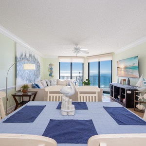 Gather around the dining table, enjoying coastal decor and views that invite relaxation and connection