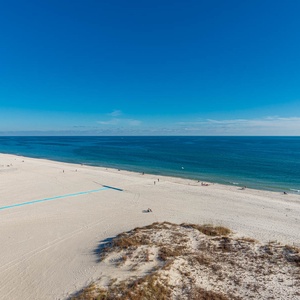 Enjoy breathtaking beachfront views from your private balcony, perfect for relaxation and soaking in the scenery