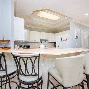 Savor your morning coffee at the breakfast bar while chatting and enjoying the inviting kitchen atmosphere