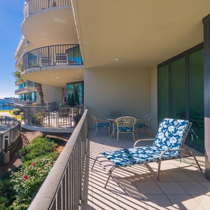 Bask in the sun on the balcony, soaking in views of the lush landscape and calming waterfront vibes
