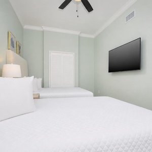 Unwind in this queen guest suite and stream your favorite shows or enjoy a good movie after a beach day