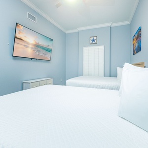 Unwind in this queen guest suite and stream your favorite shows or enjoy a good movie after a beach day