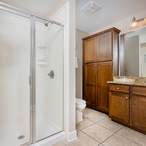 Refresh and revitalize in the spacious walk-in shower, creating an invigorating start to your beach day
