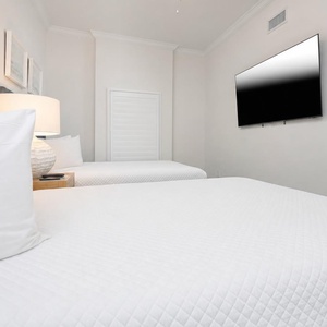 Unwind in this queen guest suite and stream your favorite shows or enjoy a good movie after a beach day