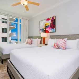 Savor peaceful nights in one of the queen beds in this guest room, where coastal views inspire restful slumber