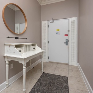 Step into a welcoming entryway with a charming console table, inviting you to enjoy your beach getaway