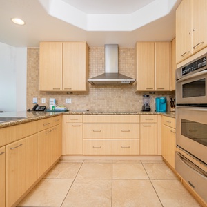 Kitchen featuring sleek stainless appliances and elegant granite countertops, perfect for culinary adventures