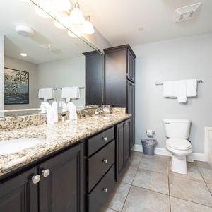 Experience the master bathroom featuring a granite countertop, relaxing jetted tub, and walk-in shower