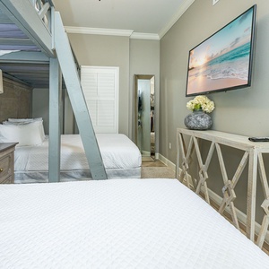 Perfect for families, custom built-in bunks with queen below and oversized twin above, plus flat screen tv for relaxing after a day at the beach