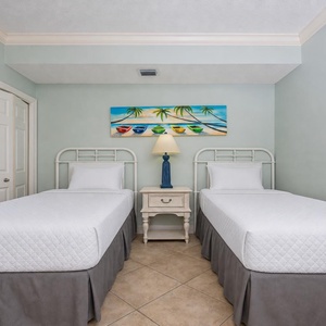 Relax on one of the cozy twin beds in this guest suite and enjoy a peaceful slumber