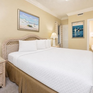 Retreat to this inviting guest bedroom featuring a king bed, tasteful decor, and soft lighting for a restful stay