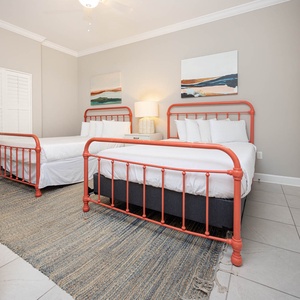 Sleep peacefully in this guest bedroom, where plush queen beds invite relaxation after a day of beachside fun