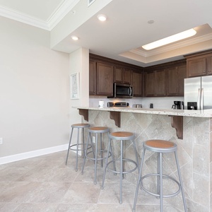 Sip your morning coffee at the charming bar, soaking in the relaxing ambiance of your beach retreat