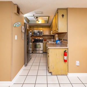 Whip up family-favorite meals in this cozy kitchen, complete with white appliances and stylish countertops