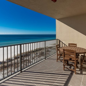 Enjoy meals or drinks at the outdoor dining set while taking in the expansive water views from your balcony