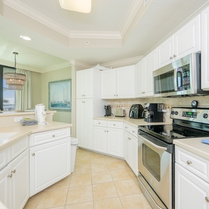 Craft delightful meals in this stylish kitchen, where stainless appliances and coastal decor enhance your creativity