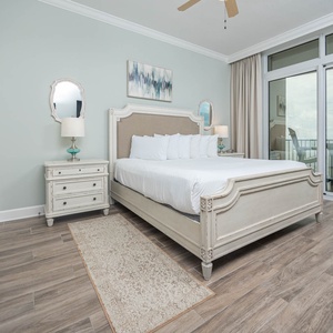 Retreat to the king master suite with cozy bedding and drift off to the sound of the waves from the balcony