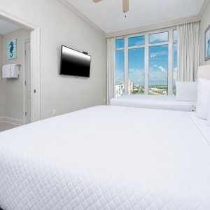 Unwind in this queen guest suite and stream your favorite shows or enjoy a good movie after a beach day