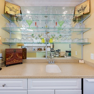 Mix your favorite drinks at the inviting wet bar, adding flair to your relaxation while gathering with loved ones