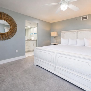 Unwind in the serene master suite featuring a king bed, stylish decor, and easy access to the master bath