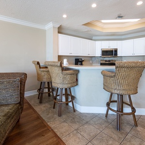 Wake up with morning coffee at the breakfast bar and get ready for a beach day in this stylish space