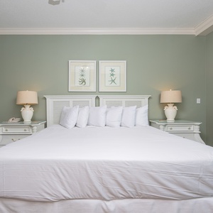 Retreat to the king master suite with cozy bedding and drift off to coastal sights and sounds of the bay