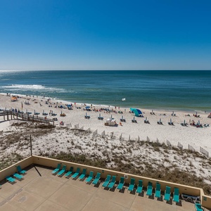 Bask in the sun from your private balcony overlooking the serene beach and sparkling waters, perfect for relaxation