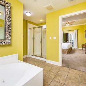In the master suite bathroom, unwind in the jetted tub or refreshing walk-in shower after a beach day