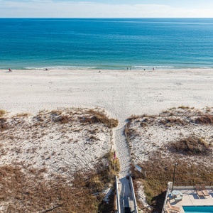 Enjoy stunning beachfront views and easy access to the sandy shore from this inviting outdoor area