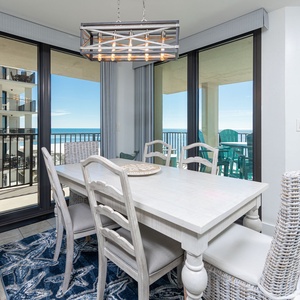 Dine at the spacious table while enjoying sweeping views of the calm waters and the inviting balcony