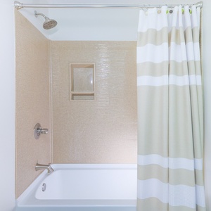 Rejuvenate in the serene tub in the guest bath, where each shower refreshes your vacation experience