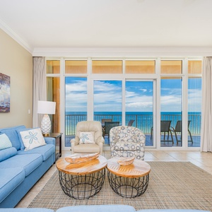 Enjoy the light-filled living space, featuring comfortable seating and stunning beach views