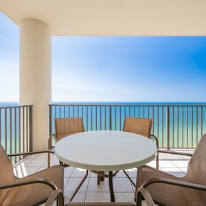 Relaxing views from the balcony, featuring a round table and comfortable chairs for relaxing moments