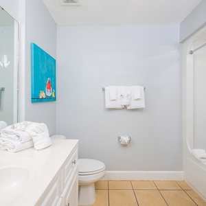 Freshen up in this guest bath in the relaxing shower or soothing tub before an exciting day