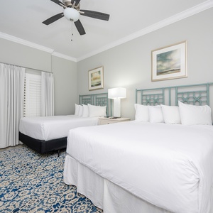 Relax on one of the cozy queen beds in this guest suite and enjoy a restful night