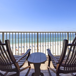 Embrace beachside bliss as you unwind in rocking chairs on the balcony, soaking up beach views and coastal vibes