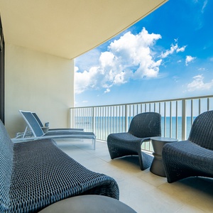 Relax on the balcony in stylish seating, enjoying breathtaking views of the pristine gulf water and bright blue sky