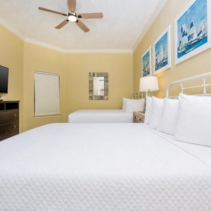 Drift into relaxation on the soft queen beds while streaming your favorite shows in this guest suite