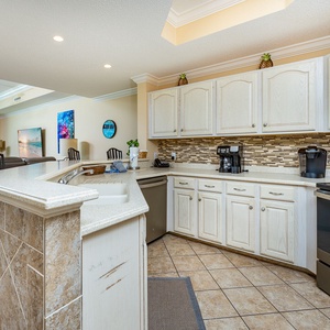 Imagine preparing fresh snacks at the breakfast bar while chatting with family in the open living room nearby