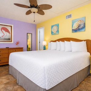 Drift into restful nights in the king guest suite, surrounded by vibrant coastal decor that enhances your relaxation