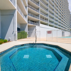 Soak in the inviting hot tub, just steps from the beach, perfect for unwinding after a day of seaside fun