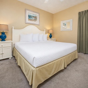 Retreat to the serene king suite featuring a plush bed, decorative accents, and a cozy vibe for restful nights