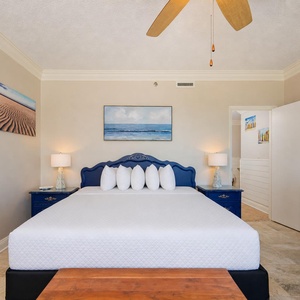 Drift into a peaceful night's sleep in the master bedroom, embraced by soft linens and calming coastal decor