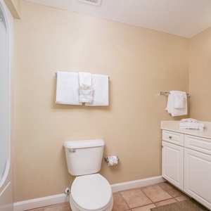 Freshen up in this guest bath in the relaxing shower or soothing tub before an exciting day